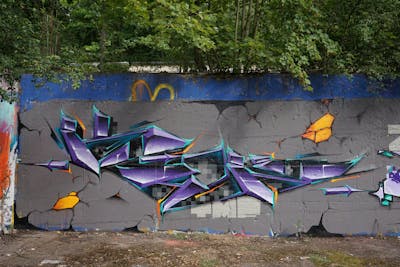 Violet and Grey Stylewriting by TMF and Kan. This Graffiti is located in Weimar, Germany and was created in 2020. This Graffiti can be described as Stylewriting, Futuristic and Wall of Fame.