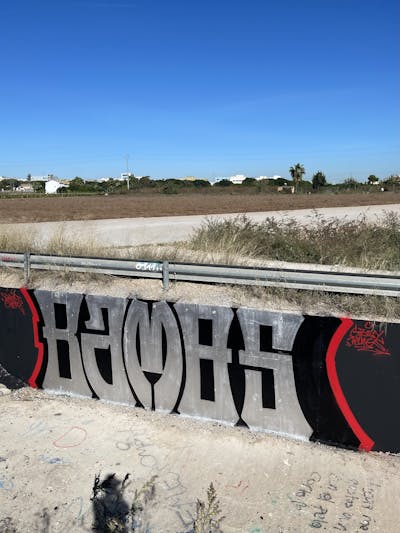 Black and Red and Chrome Stylewriting by Bamos. This Graffiti is located in Valencia, Spain and was created in 2022.