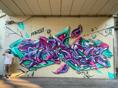 Cyan and Violet Stylewriting by Fares. This Graffiti is located in Milano, Italy and was created in 2022. This Graffiti can be described as Stylewriting and 3D.