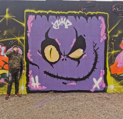 Violet Characters by Turm. This Graffiti is located in HALLE, Germany and was created in 2022. This Graffiti can be described as Characters and Wall of Fame.
