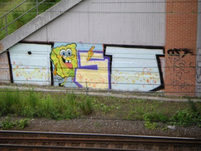 Colorful Stylewriting by urine, Bob and OST. This Graffiti is located in Leipzig, Germany and was created in 2005. This Graffiti can be described as Stylewriting, Line Bombing, Roll Up and Characters.