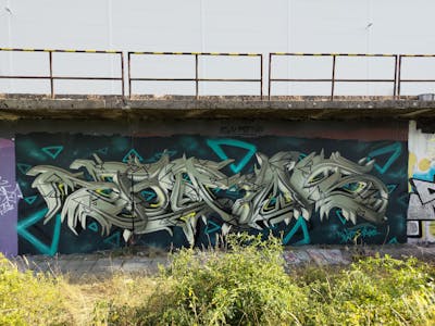 Cyan and Light Green Stylewriting by Sainter. This Graffiti is located in Bratislava, Slovakia and was created in 2022. This Graffiti can be described as Stylewriting and 3D.
