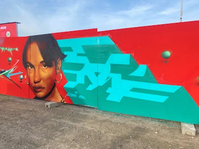 Cyan and Red Stylewriting by Sirom. This Graffiti is located in Leipzig, Germany and was created in 2024. This Graffiti can be described as Stylewriting and Characters.