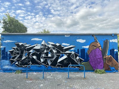 Grey and Black and Light Blue Stylewriting by Gaps and BrainTV. This Graffiti is located in Leipzig, Germany and was created in 2023. This Graffiti can be described as Stylewriting, Characters and Wall of Fame.
