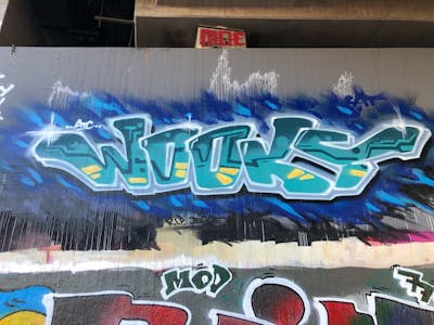 Cyan and Grey Stylewriting by WOOKY. This Graffiti is located in Leipzig, Germany and was created in 2022. This Graffiti can be described as Stylewriting and Wall of Fame.