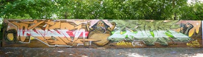Colorful and Beige Stylewriting by Ozler, Riots and Kasimir. This Graffiti is located in Dresden, Germany and was created in 2022. This Graffiti can be described as Stylewriting, Characters and Wall of Fame.
