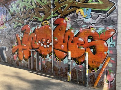 Orange Stylewriting by Faq, THEWS and CFA. This Graffiti is located in Hamilton, Canada and was created in 2023. This Graffiti can be described as Stylewriting, Characters and Wall of Fame.