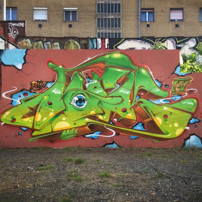 Light Green and Brown Stylewriting by Fork Imre. This Graffiti is located in Szeged, Hungary and was created in 2019.