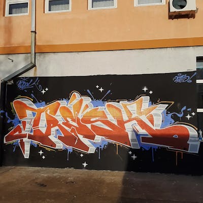 White and Orange and Light Blue Stylewriting by Tresk. This Graffiti is located in Serbia and was created in 2023. This Graffiti can be described as Stylewriting and Wall of Fame.