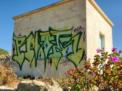 Green and Light Green Stylewriting by Riots. This Graffiti is located in Malta and was created in 2013. This Graffiti can be described as Stylewriting and Abandoned.
