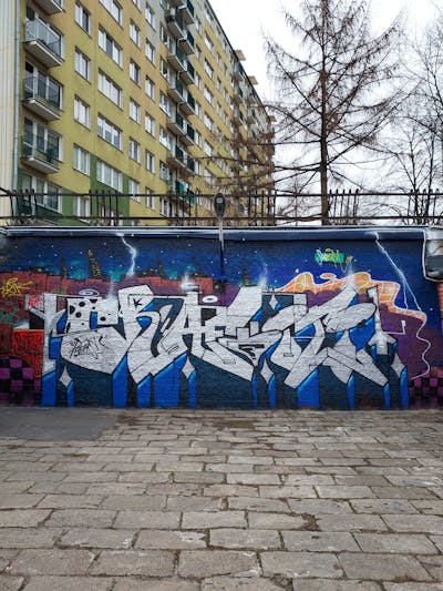 Chrome and Blue and Colorful Stylewriting by Fems173. This Graffiti is located in lublin, Poland and was created in 2023. This Graffiti can be described as Stylewriting and Wall of Fame.