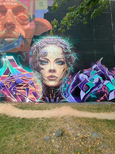 Colorful and Cyan and Violet Murals by Graff.Funk and Chiesz. This Graffiti is located in Leipzig, Germany and was created in 2023. This Graffiti can be described as Murals and Characters.