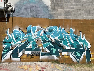 Cyan and White and Brown Stylewriting by Skew One. This Graffiti is located in Las Cruces, United States and was created in 2023.
