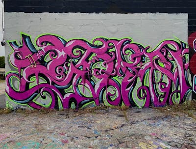 Violet and Light Green Stylewriting by Beca. This Graffiti is located in Tulsa, United States and was created in 2023.