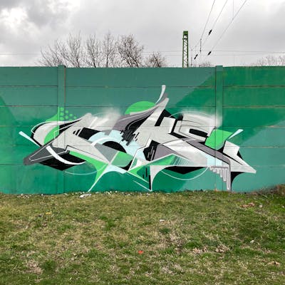 Grey and Light Green Stylewriting by Coke. This Graffiti is located in Budapest, Hungary and was created in 2024.