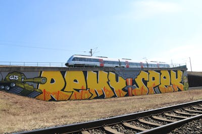 Yellow and Colorful Stylewriting by Remy and Spek. This Graffiti is located in Leipzig, Germany and was created in 2022. This Graffiti can be described as Stylewriting, Murals, Street Bombing, Characters and Line Bombing.