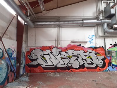 Chrome and Red Stylewriting by Se2 and Nivs. This Graffiti is located in Helsingoer, Denmark and was created in 2022. This Graffiti can be described as Stylewriting and Abandoned.