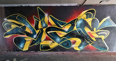 Yellow and Black and Red Stylewriting by Dyze. This Graffiti is located in Switzerland and was created in 2023.