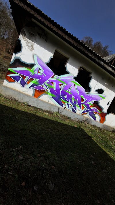 Violet and Colorful Stylewriting by KNOR. This Graffiti is located in Baia Mare, Romania and was created in 2024.
