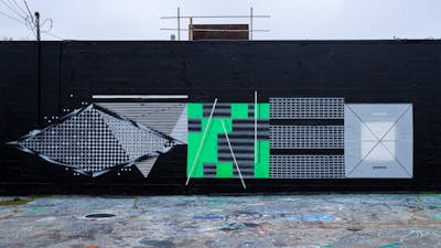 White and Light Green and Black Stylewriting by Qumes. This Graffiti is located in United States and was created in 2023. This Graffiti can be described as Stylewriting, Futuristic and Wall of Fame.
