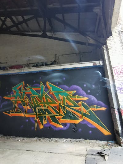 Orange and Green and Violet Stylewriting by ANGER. This Graffiti is located in Germany and was created in 2023. This Graffiti can be described as Stylewriting and Abandoned.