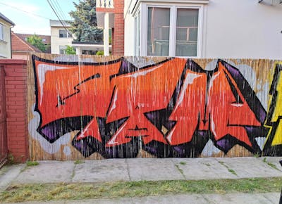Red and Black and Orange Stylewriting by 7AM. This Graffiti is located in Novi Sad, Serbia and was created in 2023. This Graffiti can be described as Stylewriting and Street Bombing.