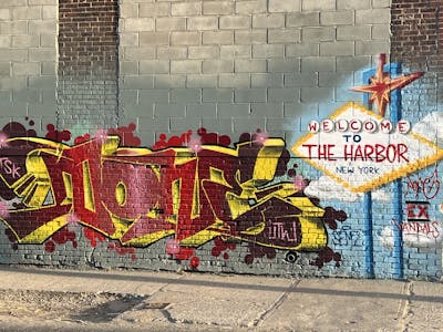 Red and Yellow Stylewriting by none. This Graffiti is located in Staten Island NY, United States and was created in 2024. This Graffiti can be described as Stylewriting, Characters and Wall of Fame.