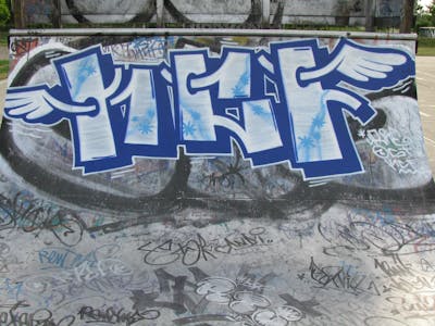 White and Blue Stylewriting by urine and KCF. This Graffiti is located in Delitzsch, Germany and was created in 2008. This Graffiti can be described as Stylewriting and Characters.