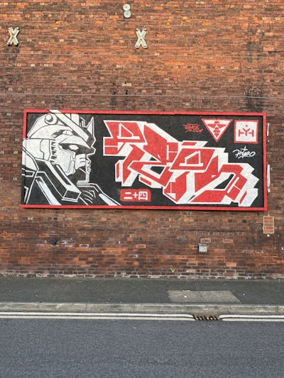 Black and Red and White Stylewriting by Hyro and TETSUO. This Graffiti is located in Leeds, United Kingdom and was created in 2024. This Graffiti can be described as Stylewriting, Characters and Streetart.
