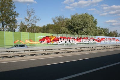 Red and Coralle and White Stylewriting by bros, NBSWE, RADICALS, RCS, rizok and R120K. This Graffiti is located in Leipzig, Germany and was created in 2020. This Graffiti can be described as Stylewriting, Characters and Street Bombing.