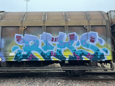 Light Blue and Yellow Stylewriting by REKS. This Graffiti is located in Italy and was created in 2024. This Graffiti can be described as Stylewriting, Trains and Freights.
