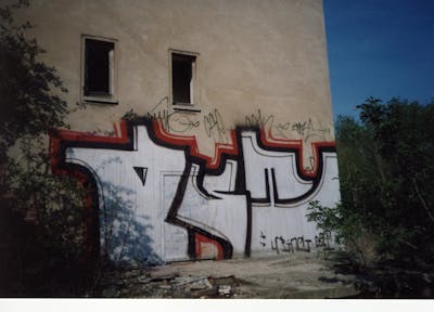 White Stylewriting by urine and OST. This Graffiti is located in Bitterfeld, Germany and was created in 2006. This Graffiti can be described as Stylewriting and Street Bombing.