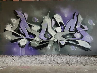 Grey and Violet Stylewriting by Doe. This Graffiti is located in Germany and was created in 2021. This Graffiti can be described as Stylewriting and Wall of Fame.