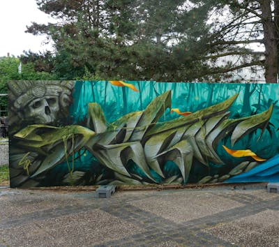 Grey and Cyan Characters by Spektrum. This Graffiti is located in Rostock, Germany and was created in 2022. This Graffiti can be described as Characters, Stylewriting, 3D and Wall of Fame.
