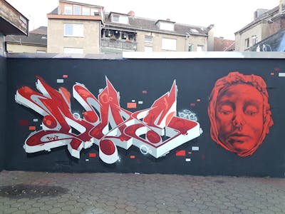 Red and White Stylewriting by Doe and Intro. This Graffiti is located in Dortmund, Germany and was created in 2021. This Graffiti can be described as Stylewriting, Characters and Wall of Fame.