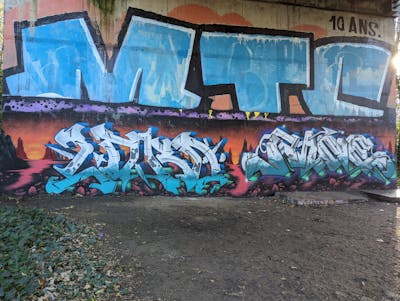 White and Cyan and Colorful Stylewriting by LORD and Pane. This Graffiti is located in Caen, France and was created in 2023. This Graffiti can be described as Stylewriting and Abandoned.
