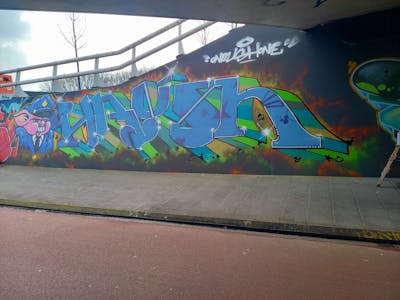 Light Blue and Light Green and Colorful Characters by Onrush73. This Graffiti is located in Uden, Netherlands and was created in 2023. This Graffiti can be described as Characters, Stylewriting and Wall of Fame.