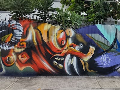 Colorful Characters by Dakpak de la selva. This Graffiti is located in Playa del Carmen, Mexico and was created in 2021. This Graffiti can be described as Characters and Streetart.
