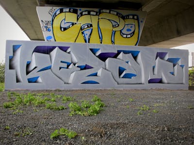 Grey Stylewriting by Kezam. This Graffiti is located in Auckland, New Zealand and was created in 2023. This Graffiti can be described as Stylewriting and 3D.