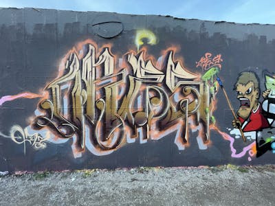 Brown and Beige Stylewriting by ORES24. This Graffiti is located in Halle, Côte d'Ivoire and was created in 2022. This Graffiti can be described as Stylewriting, Wall of Fame and Characters.