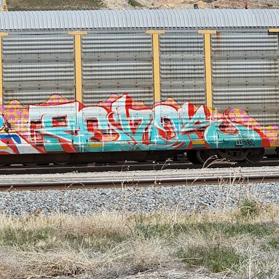 Cyan and Red Stylewriting by Revok. This Graffiti is located in United States and was created in 2022. This Graffiti can be described as Stylewriting, Trains and Freights.