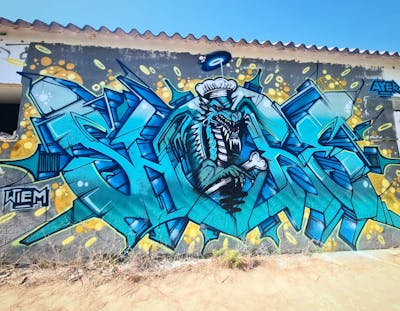 Cyan and Light Blue Stylewriting by Shibe. This Graffiti is located in Setubal, Portugal and was created in 2023. This Graffiti can be described as Stylewriting, Characters and Streetart.