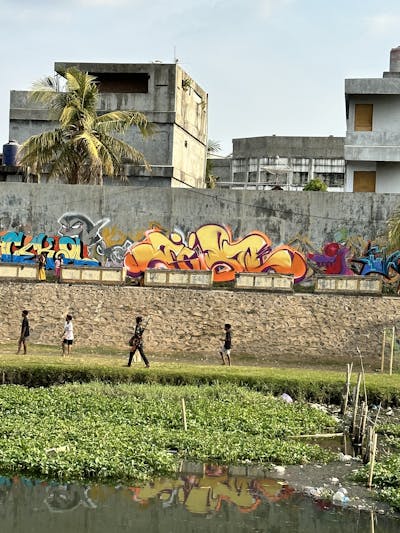 Beige and Orange Stylewriting by Jibo and MDS. This Graffiti is located in Lombok, Indonesia and was created in 2023. This Graffiti can be described as Stylewriting, Street Bombing and Atmosphere.