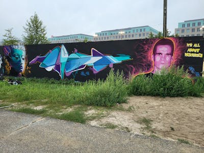 Cyan and Violet Stylewriting by Dirt, Mon_030 and Score. This Graffiti is located in Leipzig, Germany and was created in 2023. This Graffiti can be described as Stylewriting, Characters, Streetart and Wall of Fame.