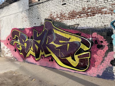 Yellow and Coralle and Brown Stylewriting by Bars. This Graffiti is located in Staten Island NY, United States and was created in 2024.