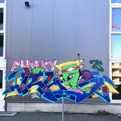 Colorful and Blue Stylewriting by Ryos. This Graffiti is located in Lausanne, Switzerland and was created in 2022. This Graffiti can be described as Stylewriting, Characters and Street Bombing.