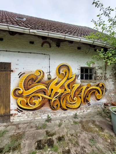 Yellow and Brown Stylewriting by Shew, the Buddys and Büro21. This Graffiti is located in Strausberg, Germany and was created in 2023. This Graffiti can be described as Stylewriting, Atmosphere and 3D.