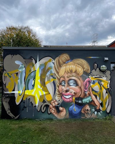 Colorful Stylewriting by Tokk and Pout. This Graffiti is located in Geldern, Germany and was created in 2022. This Graffiti can be described as Stylewriting, Characters and Wall of Fame.