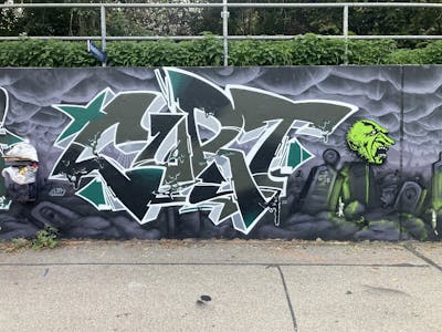 Grey and Green Stylewriting by Curt. This Graffiti is located in Ingolstadt, Germany and was created in 2022. This Graffiti can be described as Stylewriting, Characters and Wall of Fame.