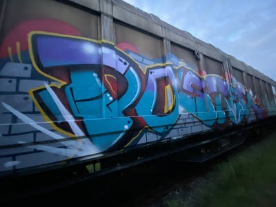 Light Blue and Colorful Stylewriting by Poster. This Graffiti is located in Germany and was created in 2023. This Graffiti can be described as Stylewriting, Trains and Freights.